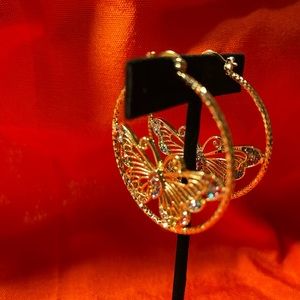 Hoop earrings with images. Butterfly, saint and small butterflies.